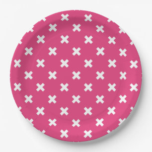 White cross stitches on fuchsia paper plates