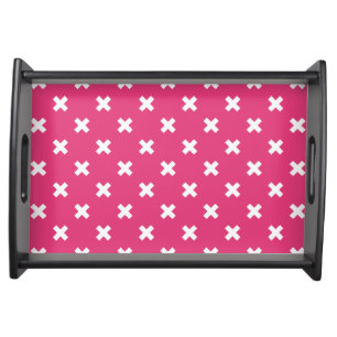 White cross stitches on fuchsia serving tray