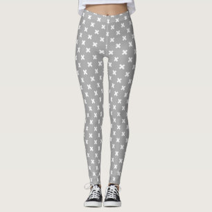 White cross stitches on gray leggings