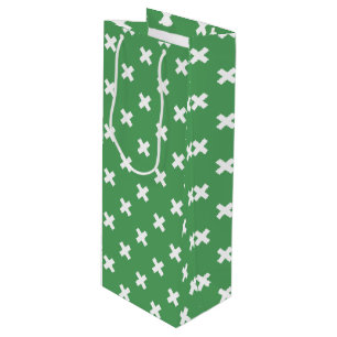 White cross stitches on green wine gift bag