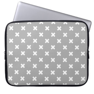 White cross stitches on grey laptop sleeve