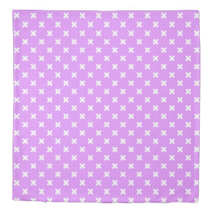 White cross stitches on lilac duvet cover