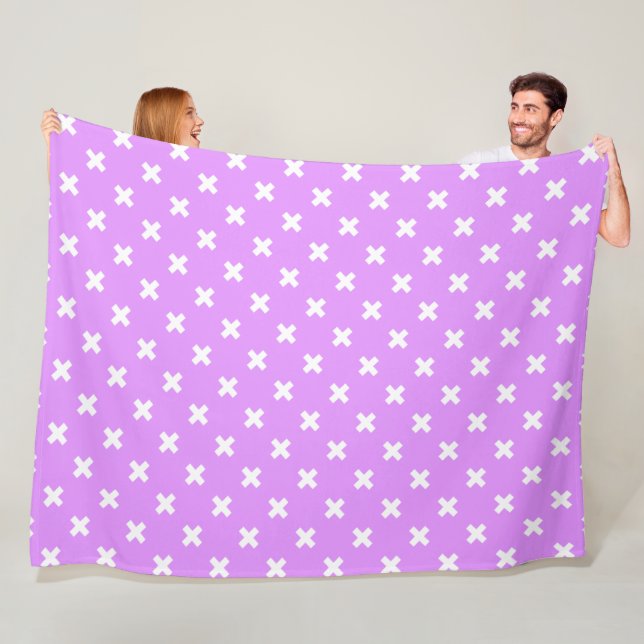 White cross stitches on lilac fleece blanket (In Situ)