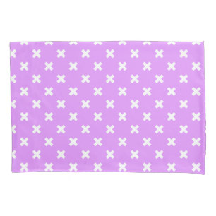 White cross stitches on lilac pillow case