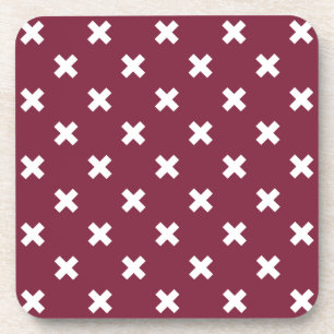 White cross stitches on mulberry beverage coaster