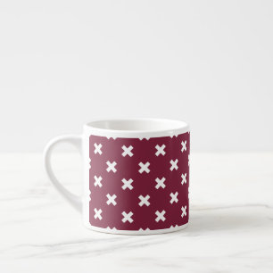 White cross stitches on mulberry espresso cup