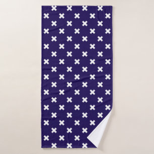 White cross stitches on navy blue bath towel