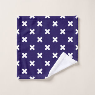 White cross stitches on navy blue wash cloth