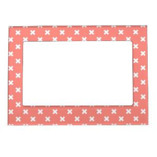 White cross stitches on peach magnetic frame
