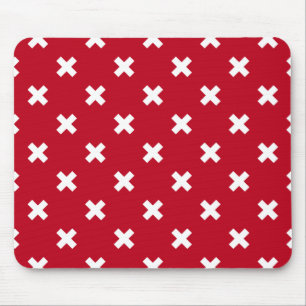 White cross stitches on red mouse pad