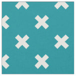 White cross stitches on teal fabric