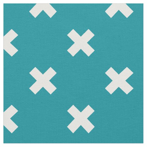 White cross stitches on teal fabric