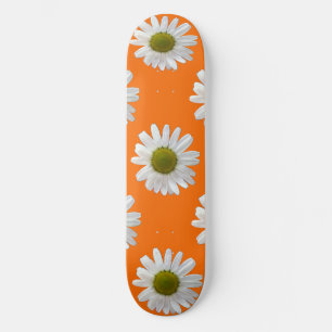 White daisies on orange skateboard deck