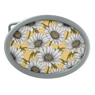 White daisies, wild flowers on yellow belt buckle