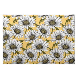 White daisies, wild flowers on yellow cloth placemat