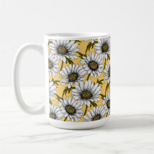 White daisies, wild flowers on yellow coffee mug