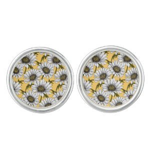 White daisies, wild flowers on yellow cufflinks