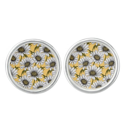 White daisies wild flowers on yellow cufflinks