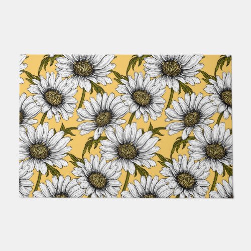 White daisies wild flowers on yellow doormat