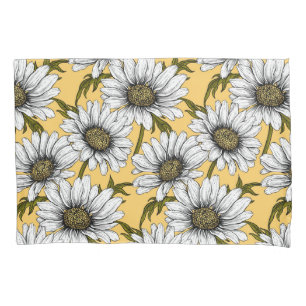 White daisies, wild flowers on yellow pillow case