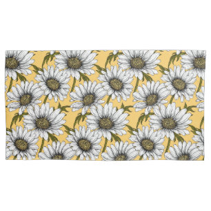 White daisies, wild flowers on yellow pillow case
