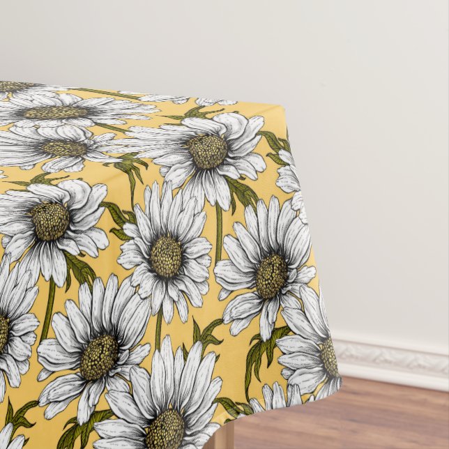 White daisies, wild flowers on yellow tablecloth (In Situ)