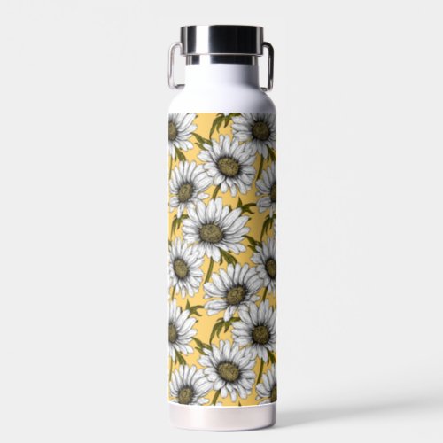 White daisies wild flowers on yellow water bottle