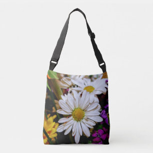 WHITE DAISY AND OTHER SPRINGTIME FLOWERS CROSSBODY BAG