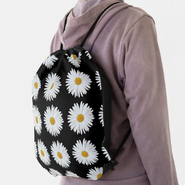 White Daisy Floral Pattern on Black Drawstring Bag (Insitu)