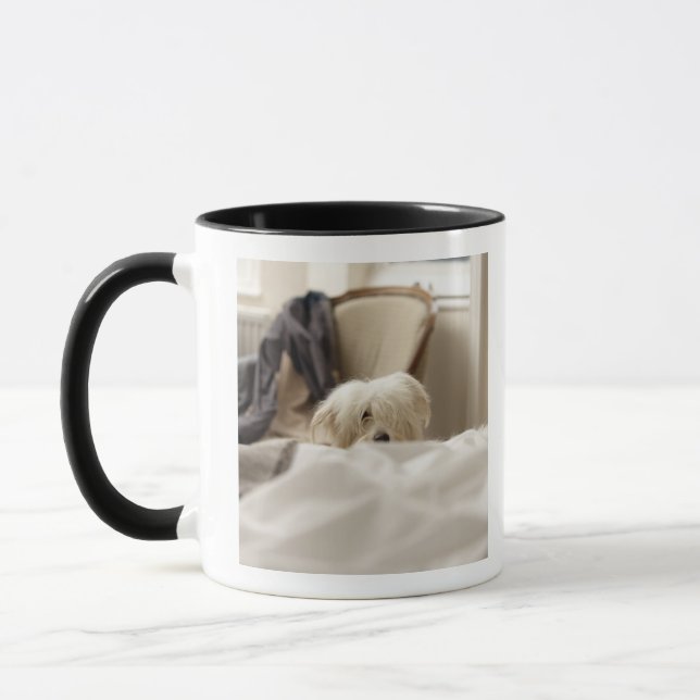 White dog hiding behind bed (differential focus) mug (Left)