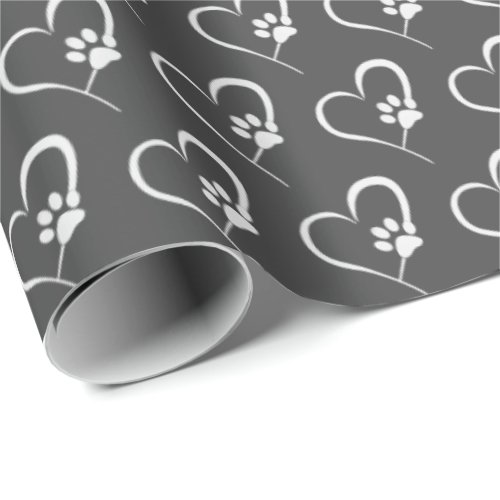 white dog paw prints on heart wrapping paper