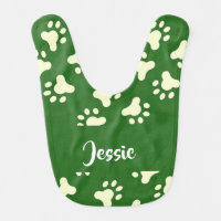 White dog paws on green baby bib