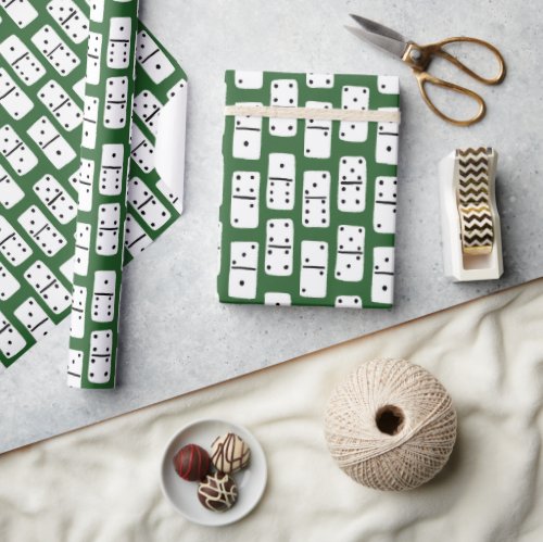 White Dominoes with Black Dots on Green Patterned Wrapping Paper