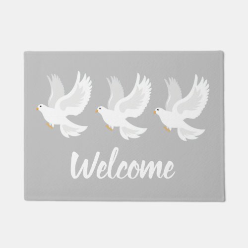 White dove bird on grey doormat