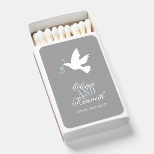 White dove blue ribbon on grey wedding favor matchboxes