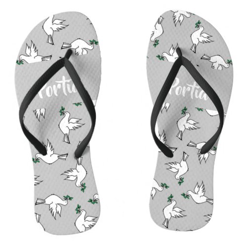 White dove with green leaves on gray flip flops