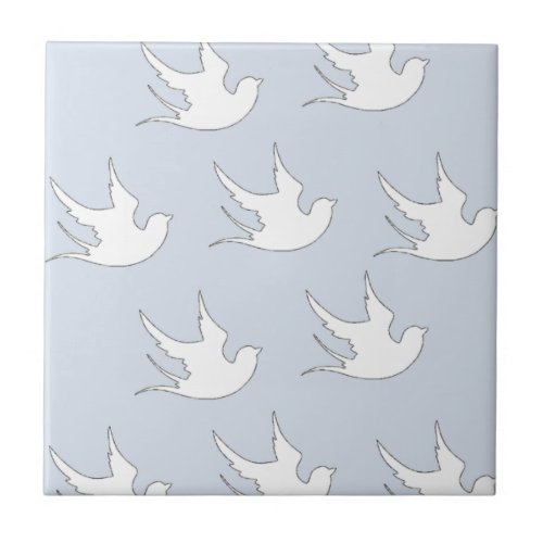 white doves on blue ceramic tile