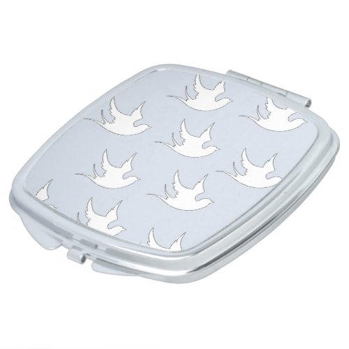 white doves on blue compact mirror