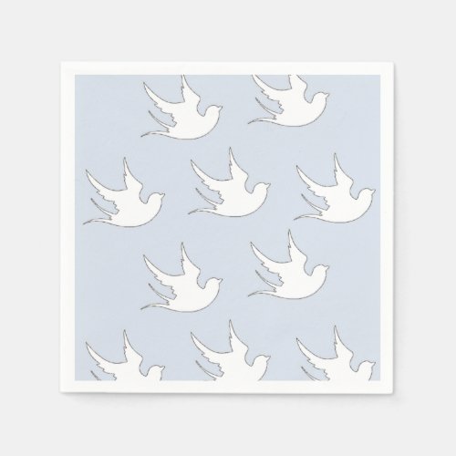 white doves on blue napkins
