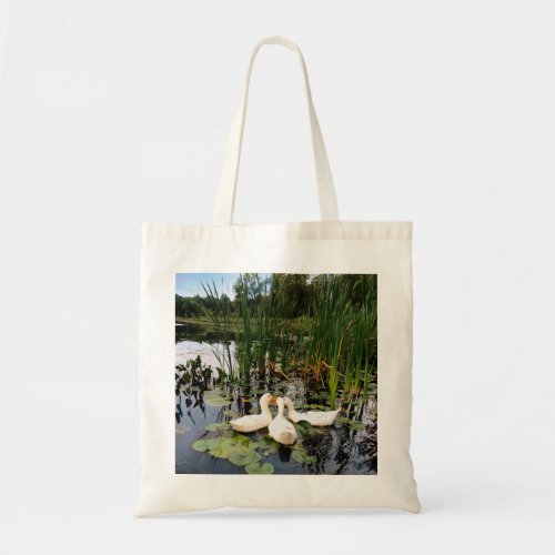 White ducks lily pads cattails lake shore tote bag