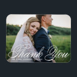White Elegant Photo Wedding Thank You Magnet<br><div class="desc">Celebrate your love and show gratitude with our customizable photo wedding thank you magnet! This unique keepsake is perfect for reminding your loved ones of your special day while expressing your heartfelt thanks in a memorable way. It features an elegant calligraphy and classic typography. You can personalize this elegant wedding...</div>