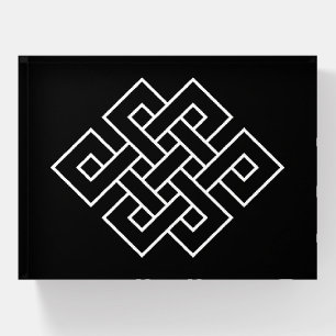 White Endless Knot Symbol on Black Paperweight