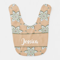 White engraved flowers on tan baby bib