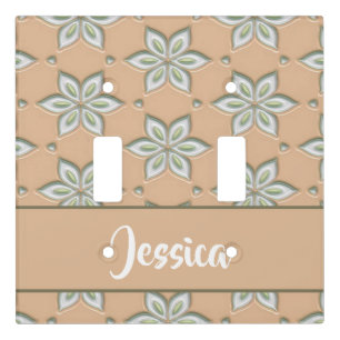 White engraved flowers on tan light switch cover