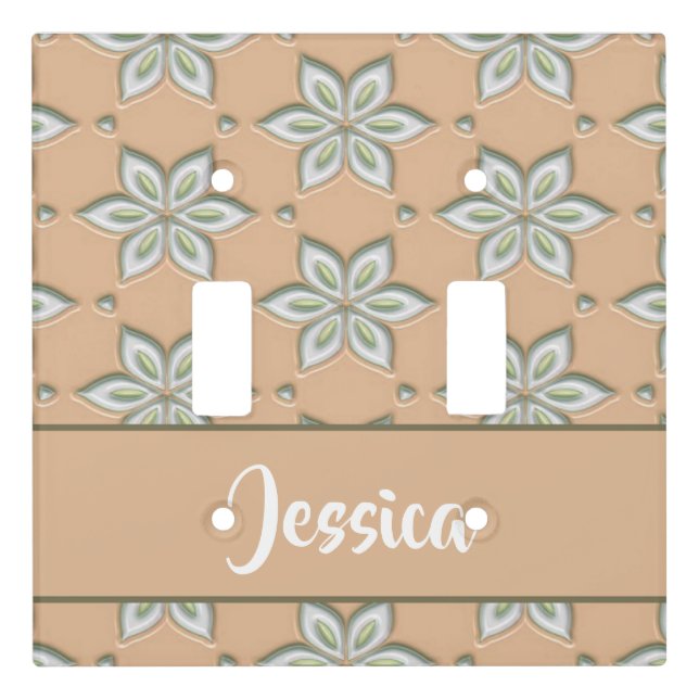 White engraved flowers on tan light switch cover (Front)