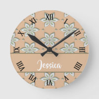 White engraved flowers on tan round clock