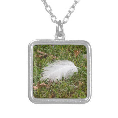 white feather on meadow silver plated necklace