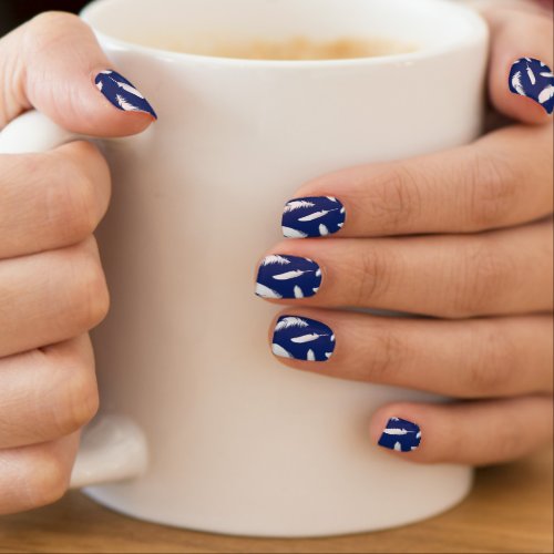 White feather print on dark blue minx nail wraps