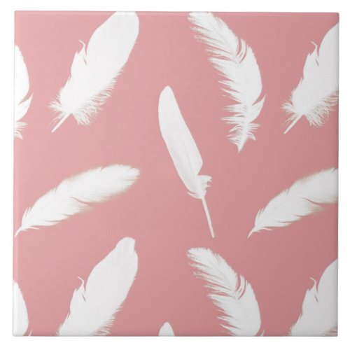 White feather print on shell pink ceramic tile