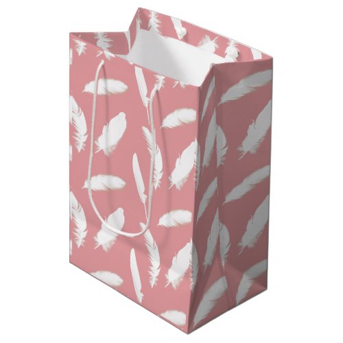 White feather print on shell pink medium gift bag